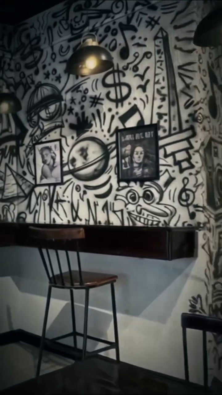 Authentic monochrome doodle wall graffiti at Boom Burger Matariya by Ahmed Zabady